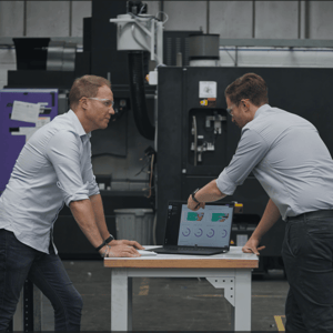 Continuous improvement manager and operations manager looking at production data