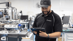 Enztec - machine operator looking at tablet computer