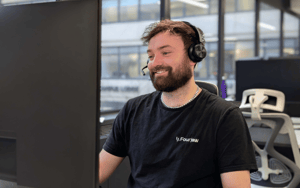 FourJaw team member on phone to a customer