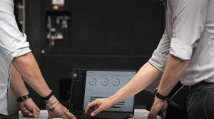 Production manager and shop floor supervisor looking at production data