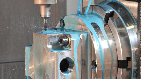 CNC machine drilling a piece of metal work