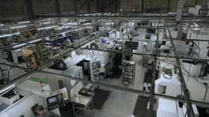 View of CNC machine son factory floor using FourJaw
