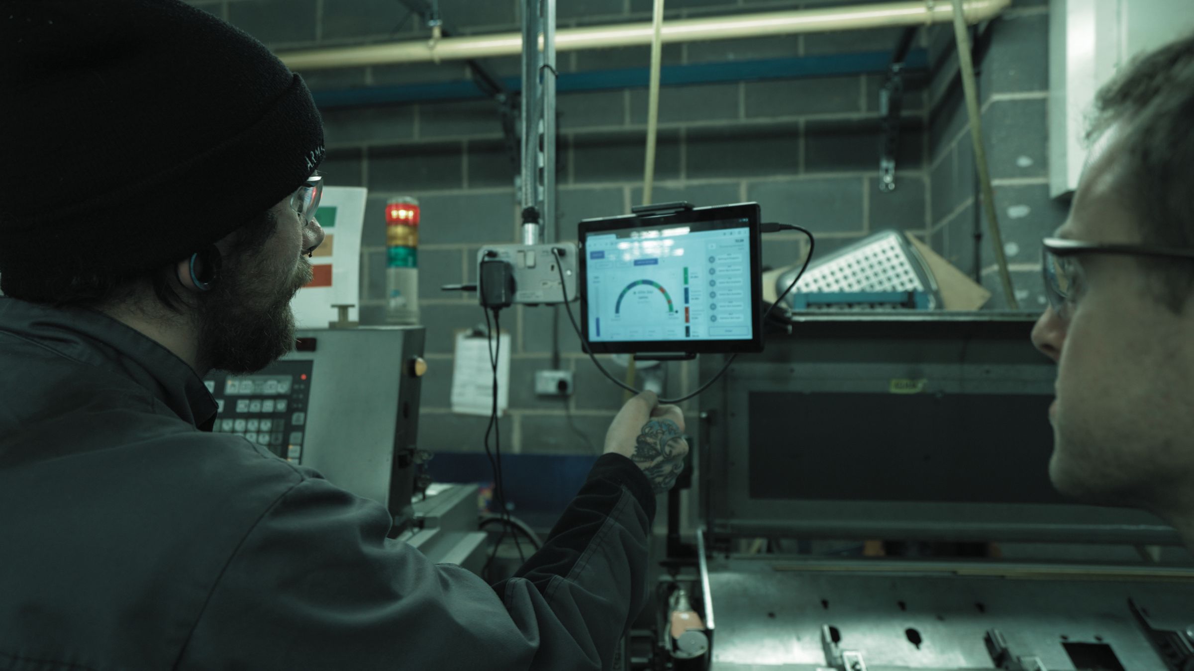 Machine Operator-using-tablet to monitor machine productivity